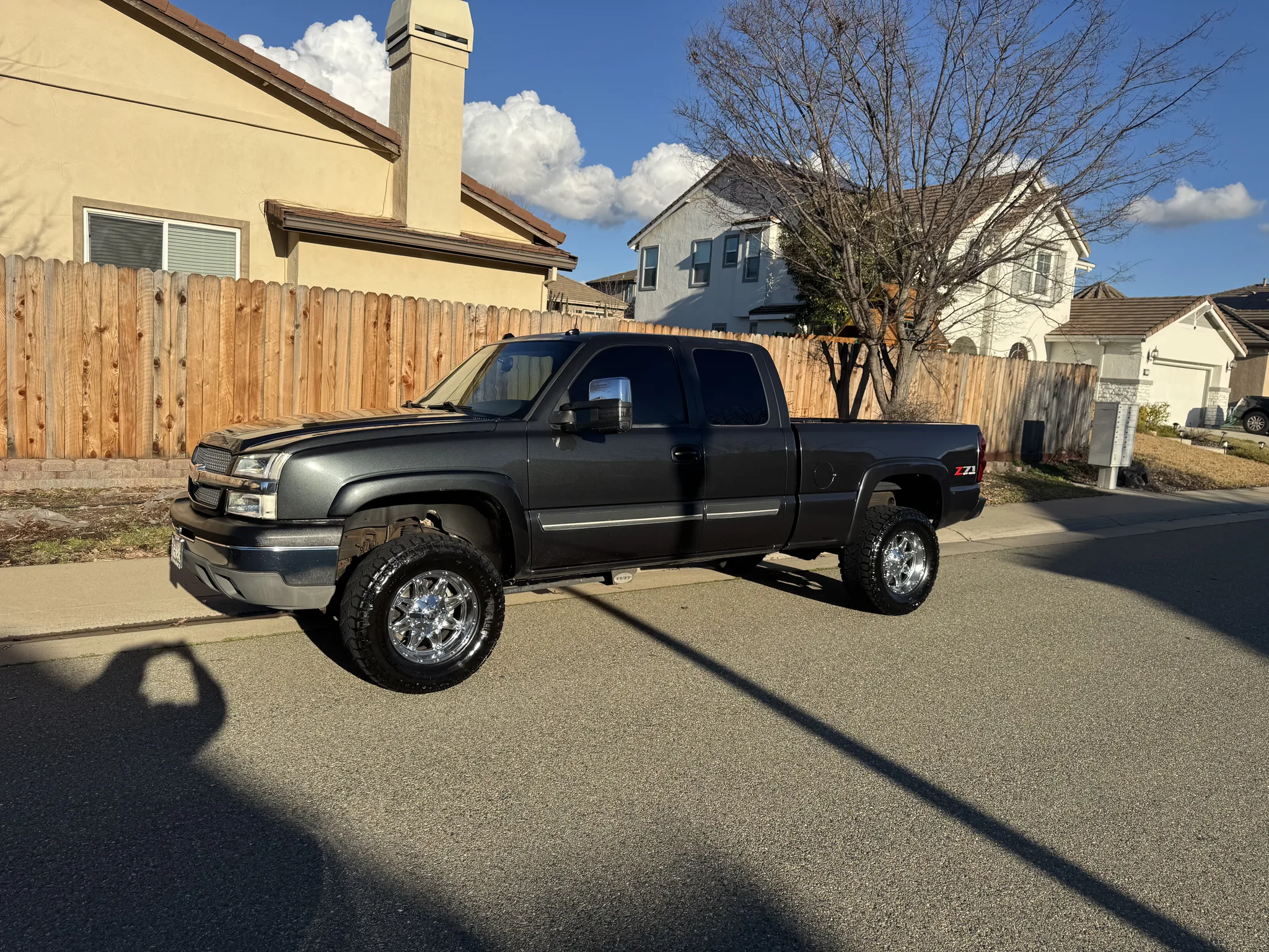Dark gray 2004 Chevrolet Silverado Z71 extended cab parked on a residential street in Turlock, California